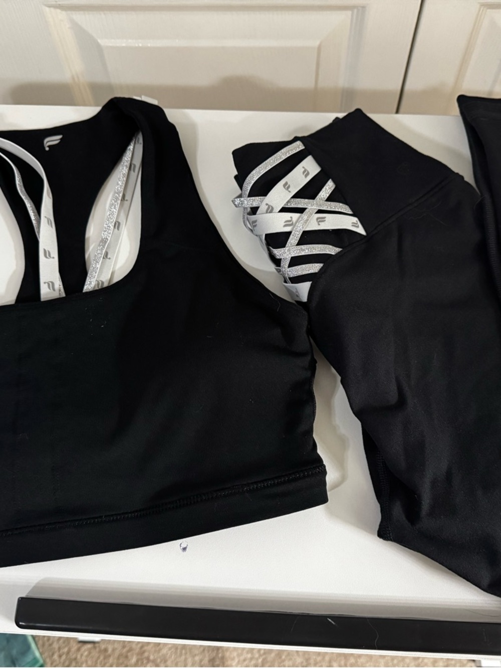 Fabletics Black PowerHold Sports Bra with matching pants plus 2 pairs of pants.